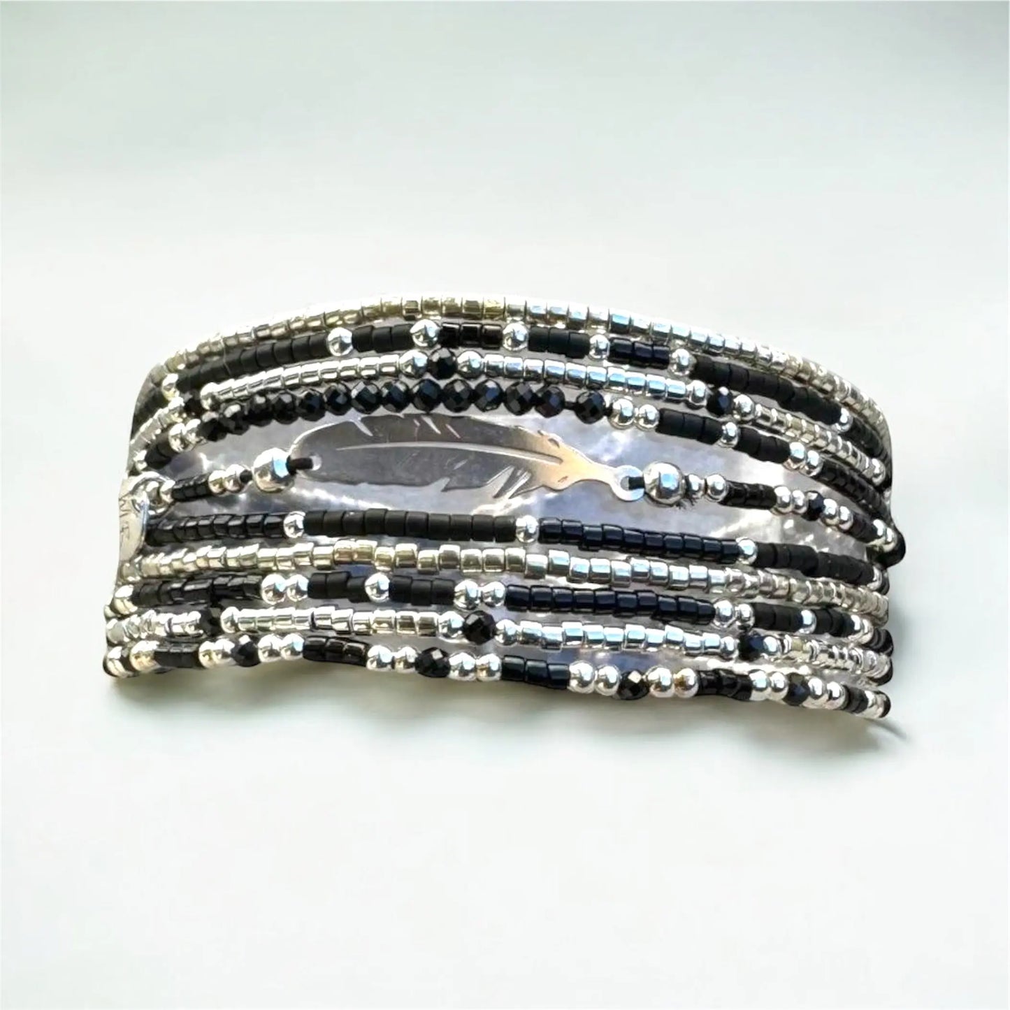 Manchette multi rangs et sa plume en argent 925