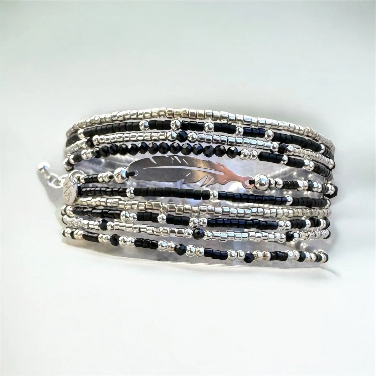 Manchette multi rangs et sa plume en argent 925